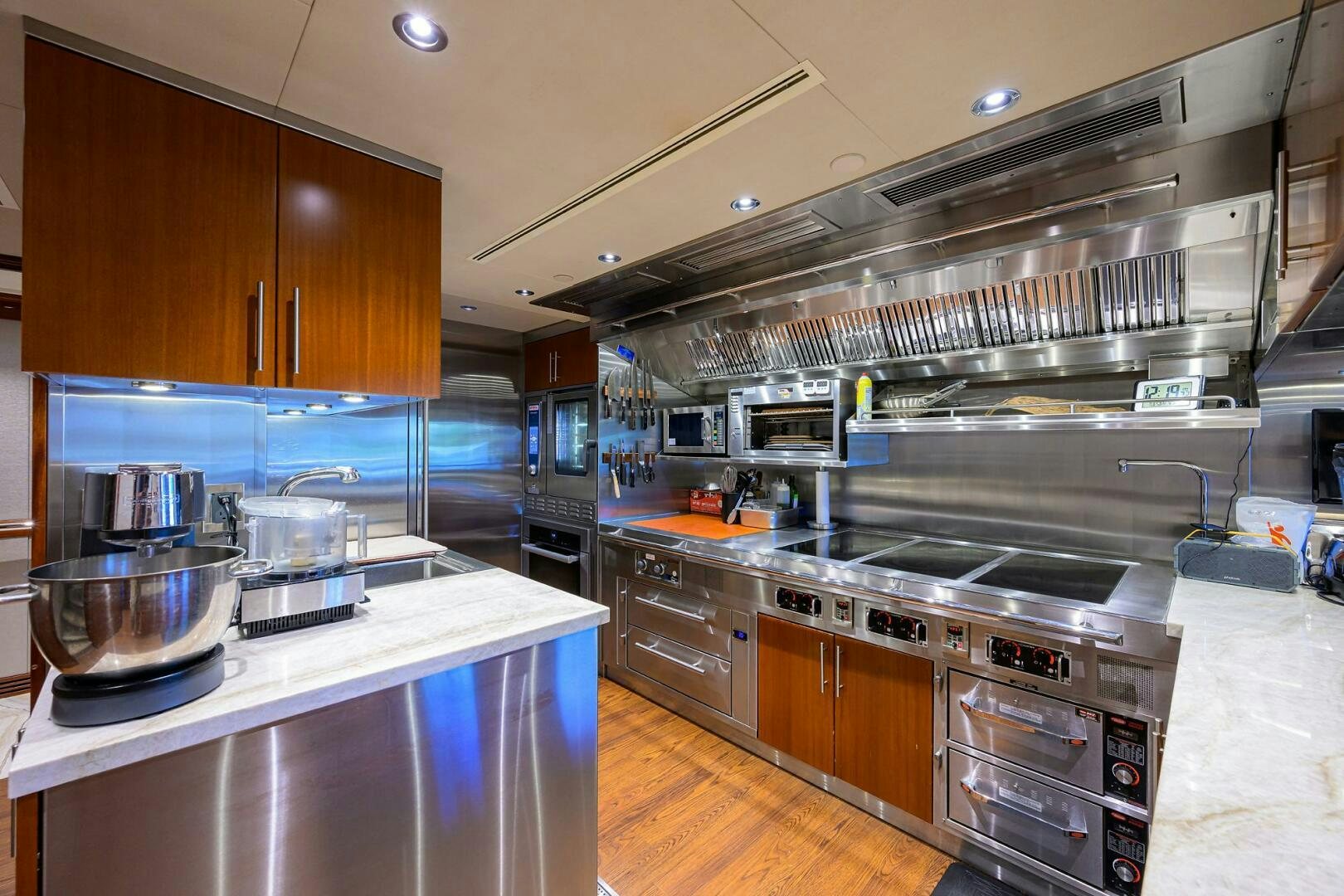a kitchen with stainless steel appliances aboard NEENAH Yacht for Sale