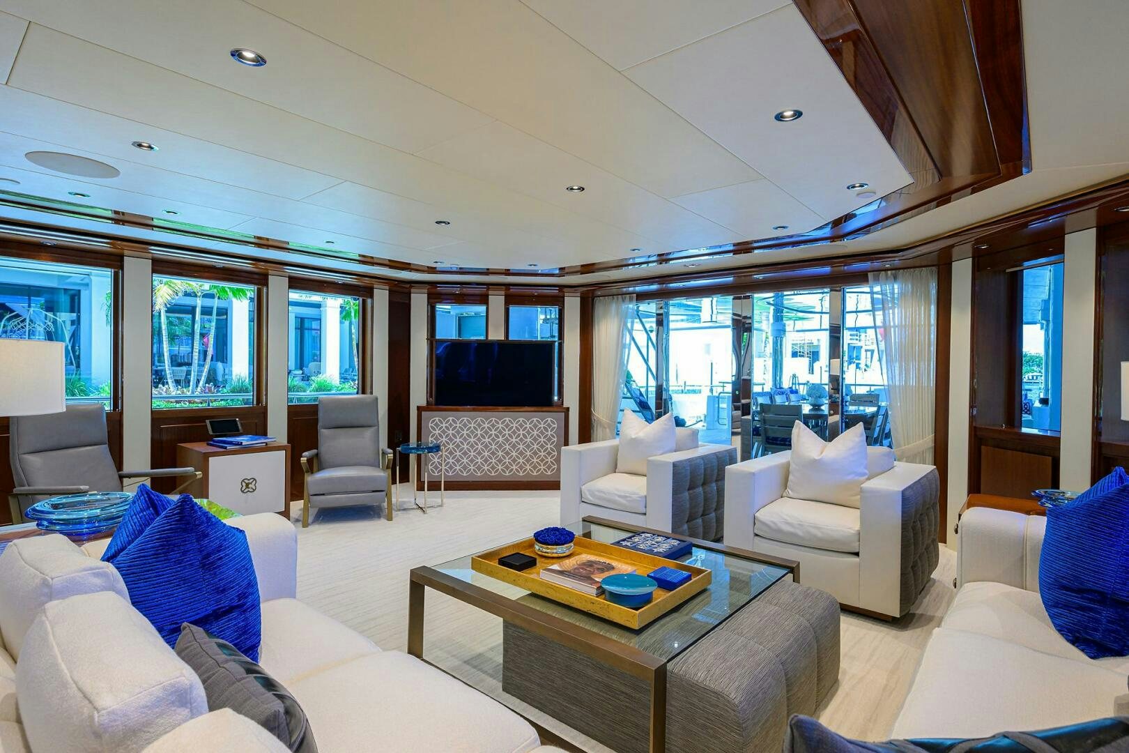 a living room with a table and chairs aboard NEENAH Yacht for Sale