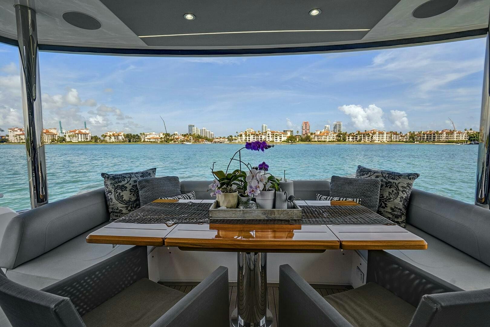 a table with a planter on it and a view of a city aboard SEA ONE Yacht for Sale