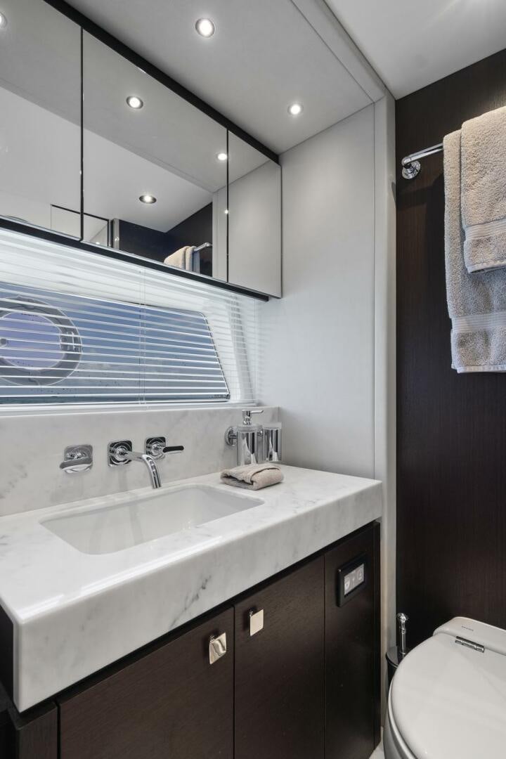 a bathroom with a sink and a mirror aboard SEA ONE Yacht for Sale