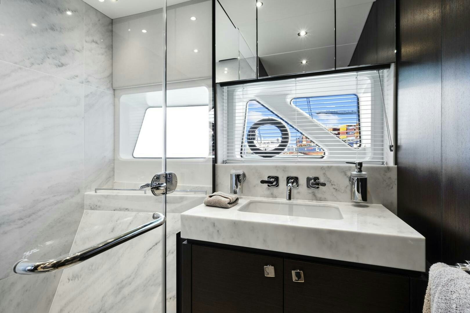 a bathroom with a sink and a mirror aboard SEA ONE Yacht for Sale