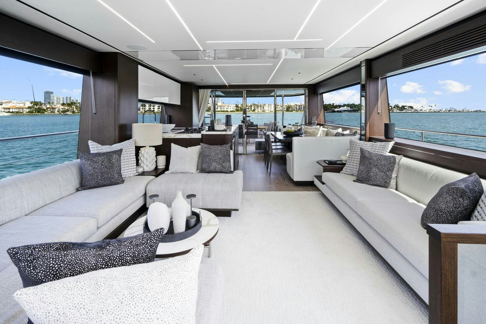 a living room with a large window aboard SEA ONE Yacht for Sale