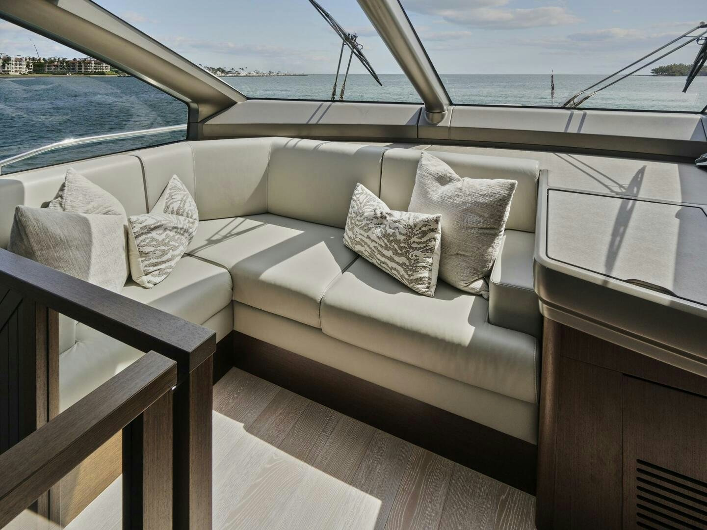 a couch with pillows on it aboard SEA ONE Yacht for Sale