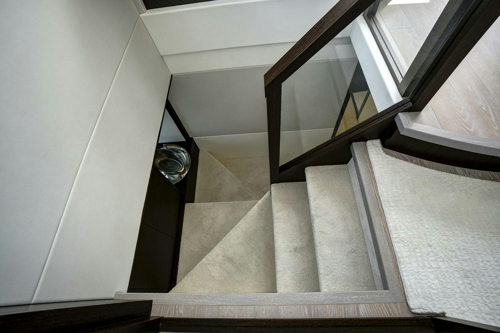 a staircase with a glass door aboard SEA ONE Yacht for Sale