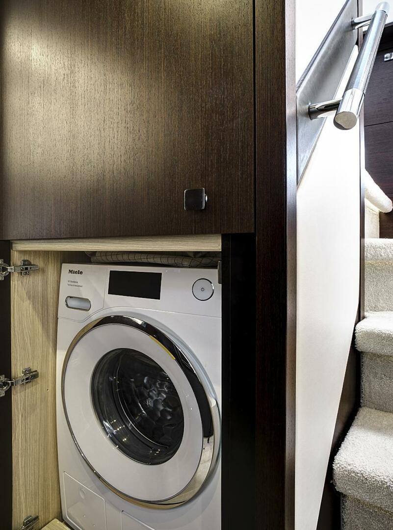 a washing machine in a room aboard SEA ONE Yacht for Sale