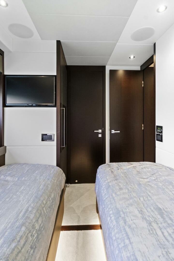 a hotel room with two beds aboard SEA ONE Yacht for Sale