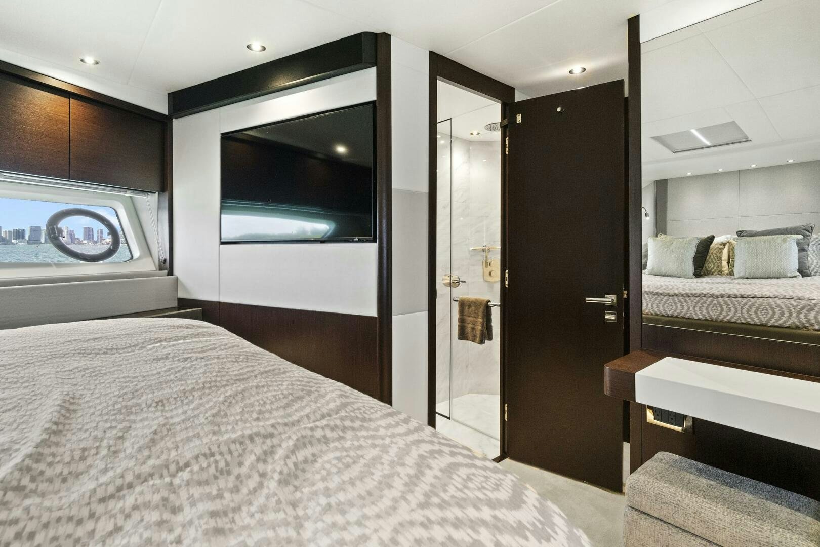 a bedroom with a large mirror aboard SEA ONE Yacht for Sale