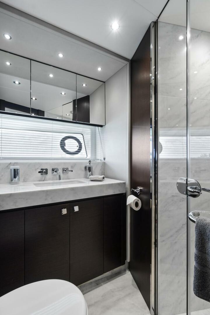 a bathroom with a shower unit and sink aboard SEA ONE Yacht for Sale