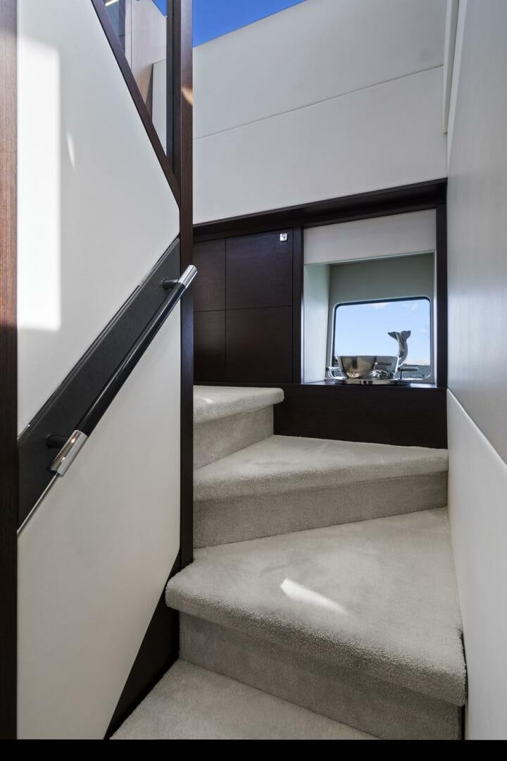 a staircase with a sink and a window aboard SEA ONE Yacht for Sale