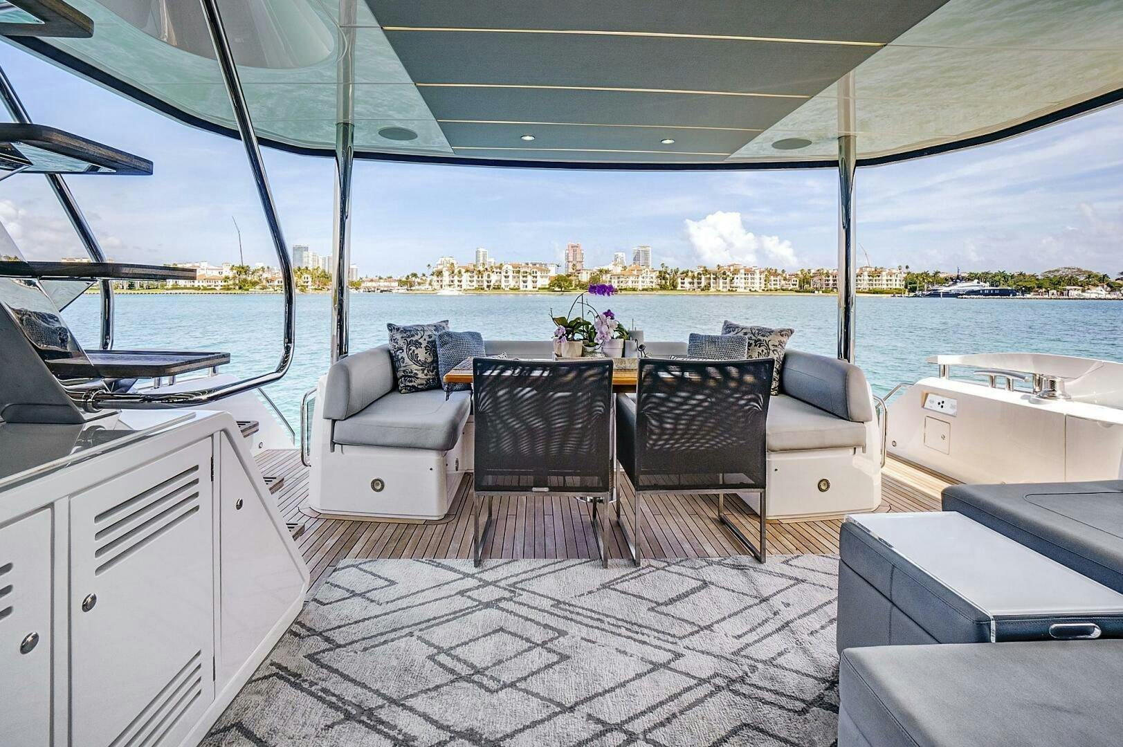 a patio with chairs and a table aboard SEA ONE Yacht for Sale