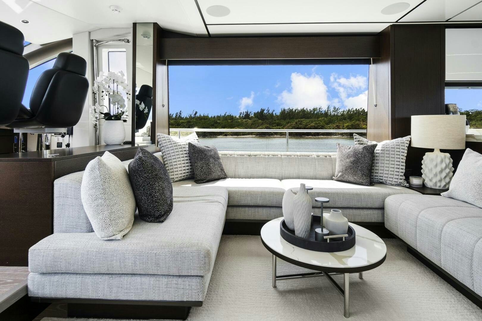 a living room with a large window aboard SEA ONE Yacht for Sale
