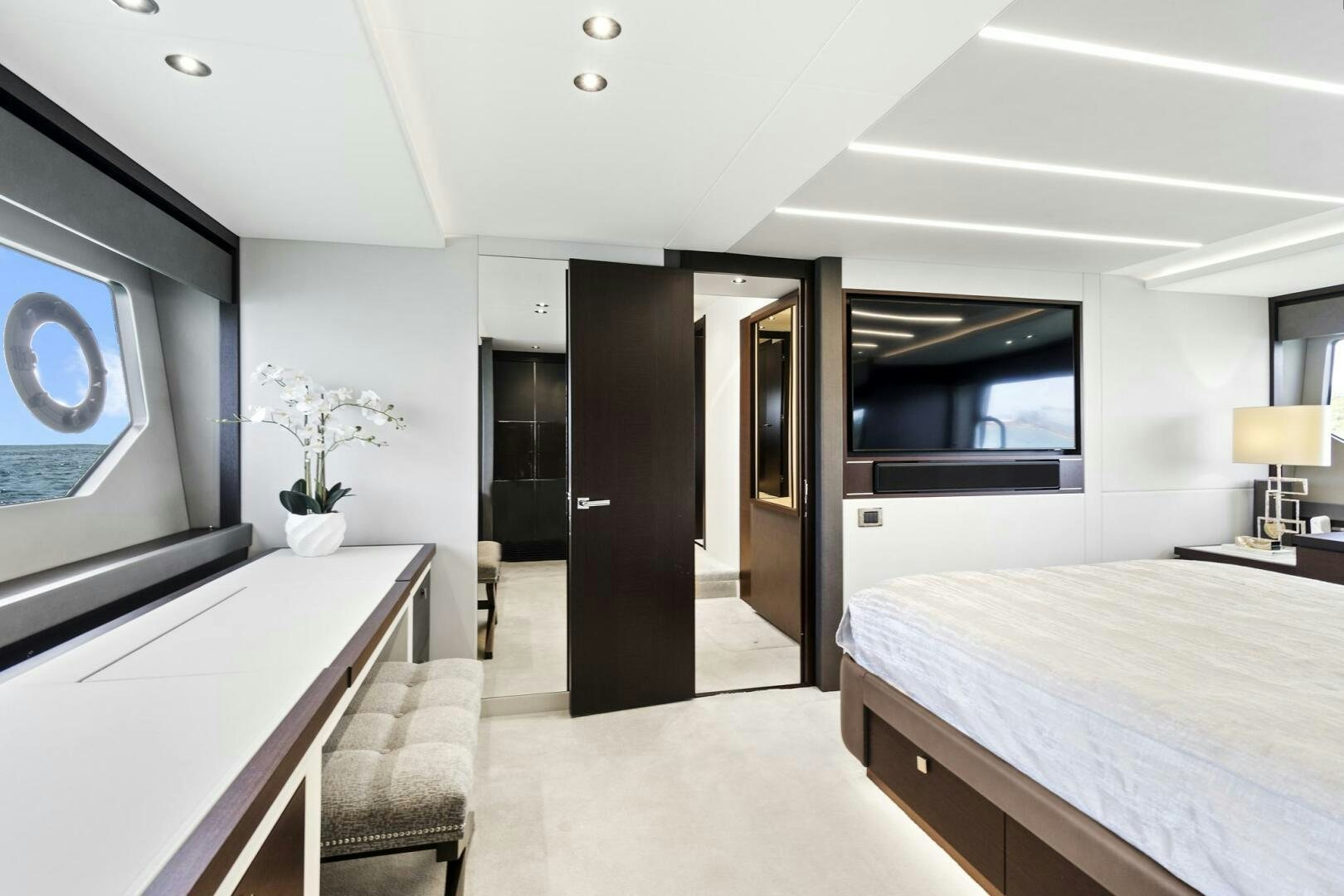 a room with a bed and a desk aboard SEA ONE Yacht for Sale
