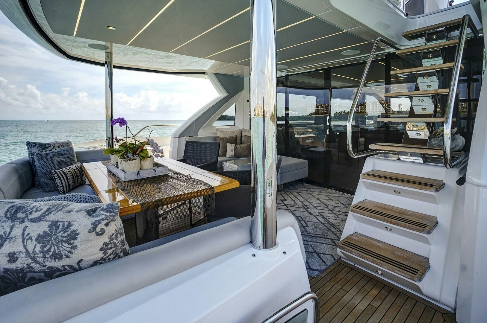 a boat with a table and couch aboard SEA ONE Yacht for Sale