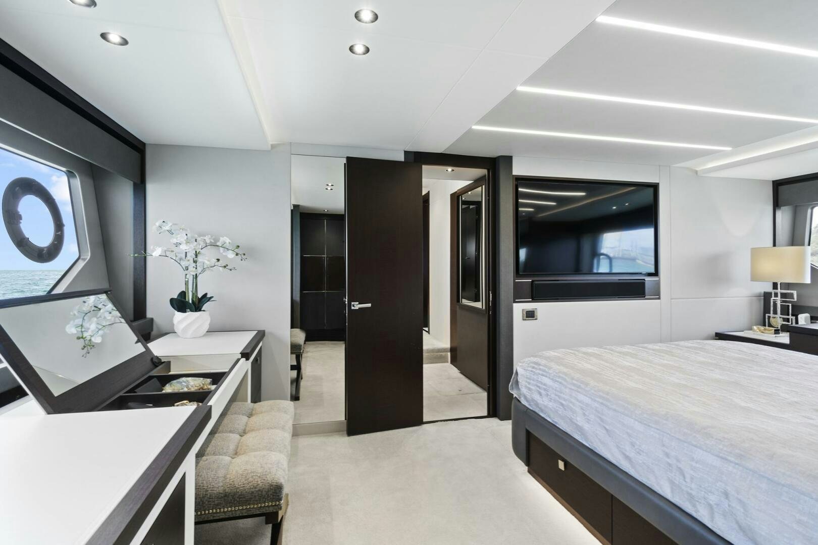 a room with a bed and a desk aboard SEA ONE Yacht for Sale