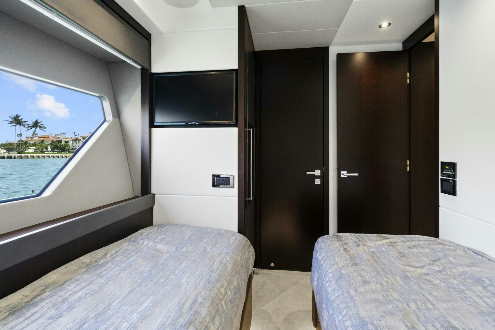 a room with a bed and a window aboard SEA ONE Yacht for Sale
