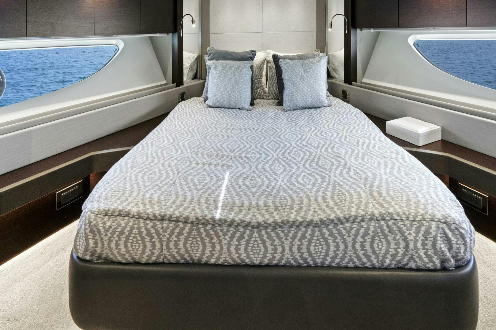 a bed with a white sheet aboard SEA ONE Yacht for Sale