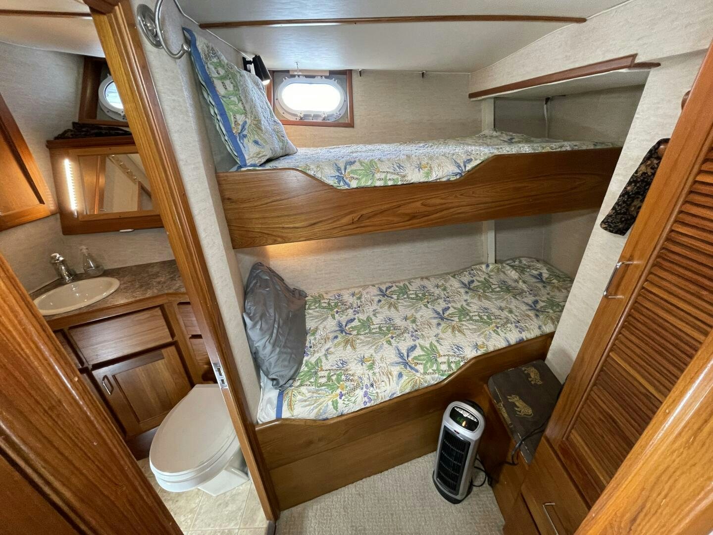 a bed in a room aboard TRAVELLER II Yacht for Sale