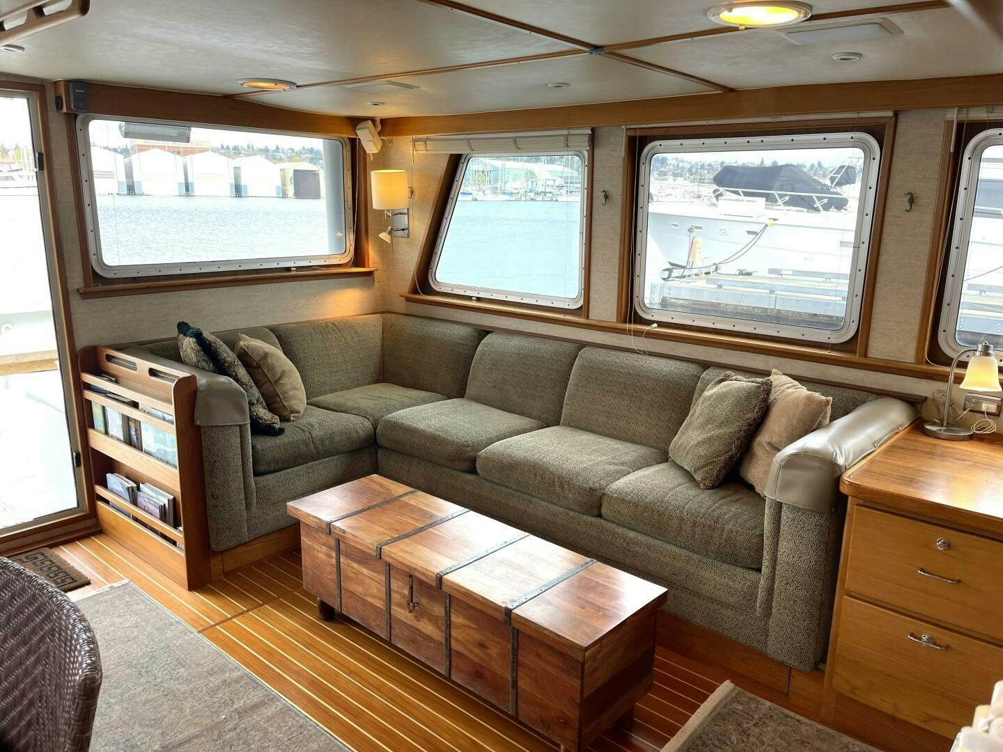 a living room with a couch and a coffee table aboard TRAVELLER II Yacht for Sale