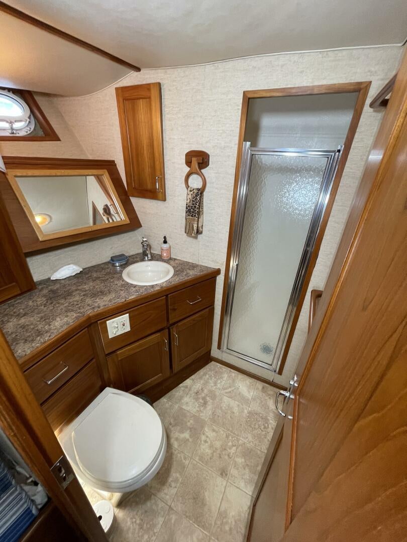 a bathroom with a sink and a toilet aboard TRAVELLER II Yacht for Sale
