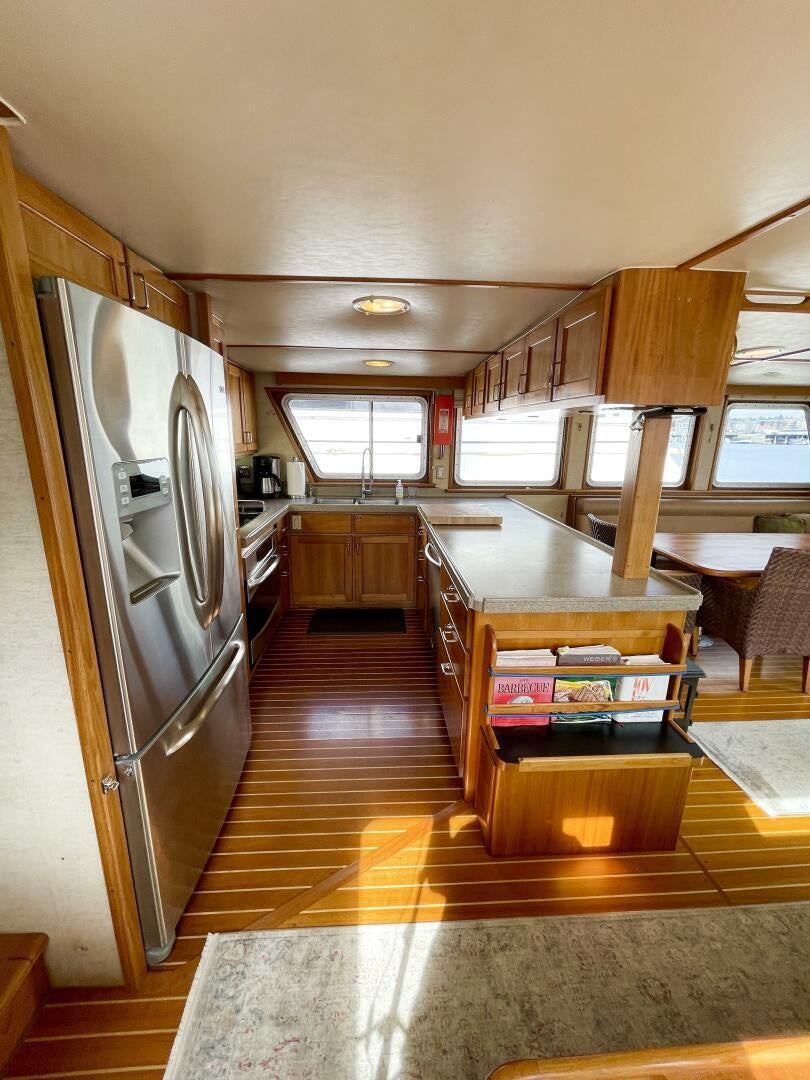 a kitchen with a large island aboard TRAVELLER II Yacht for Sale