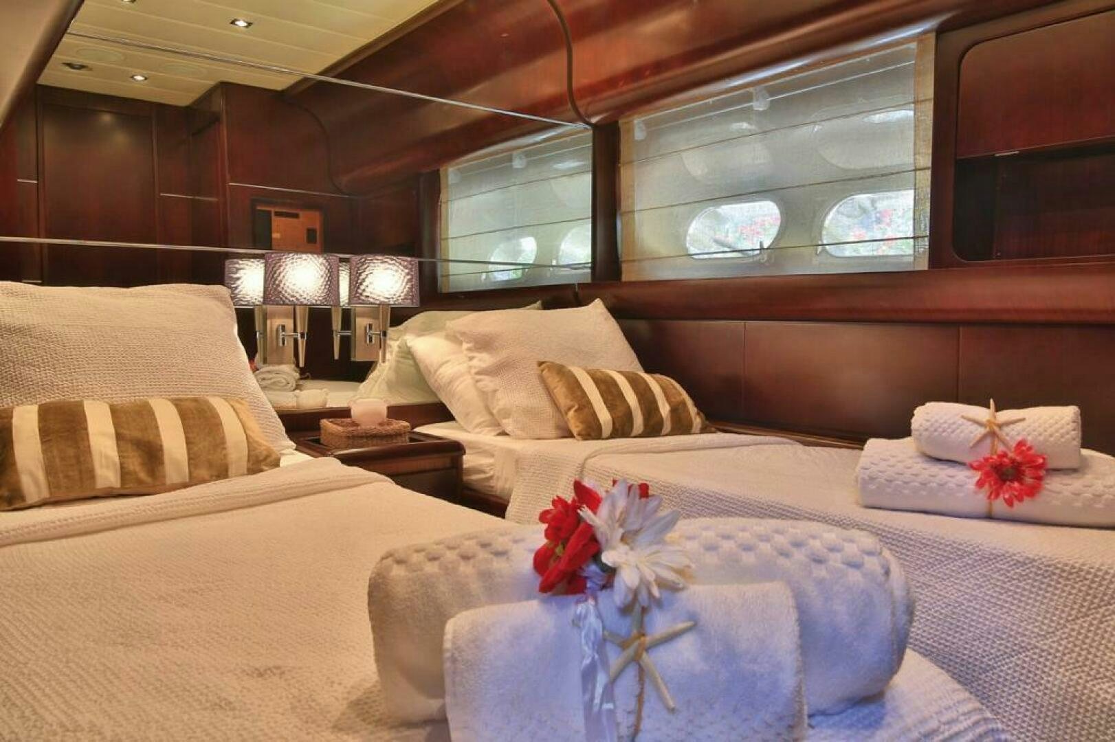 a room with a bed and a window aboard TENDER TO Yacht for Sale