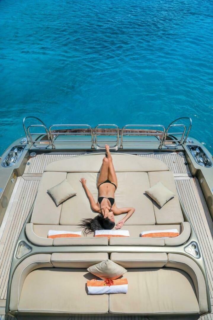 a person lying on a boat aboard TENDER TO Yacht for Sale