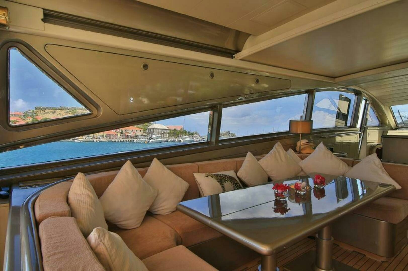 a room with a couch and a table with pillows and pillows aboard TENDER TO Yacht for Sale