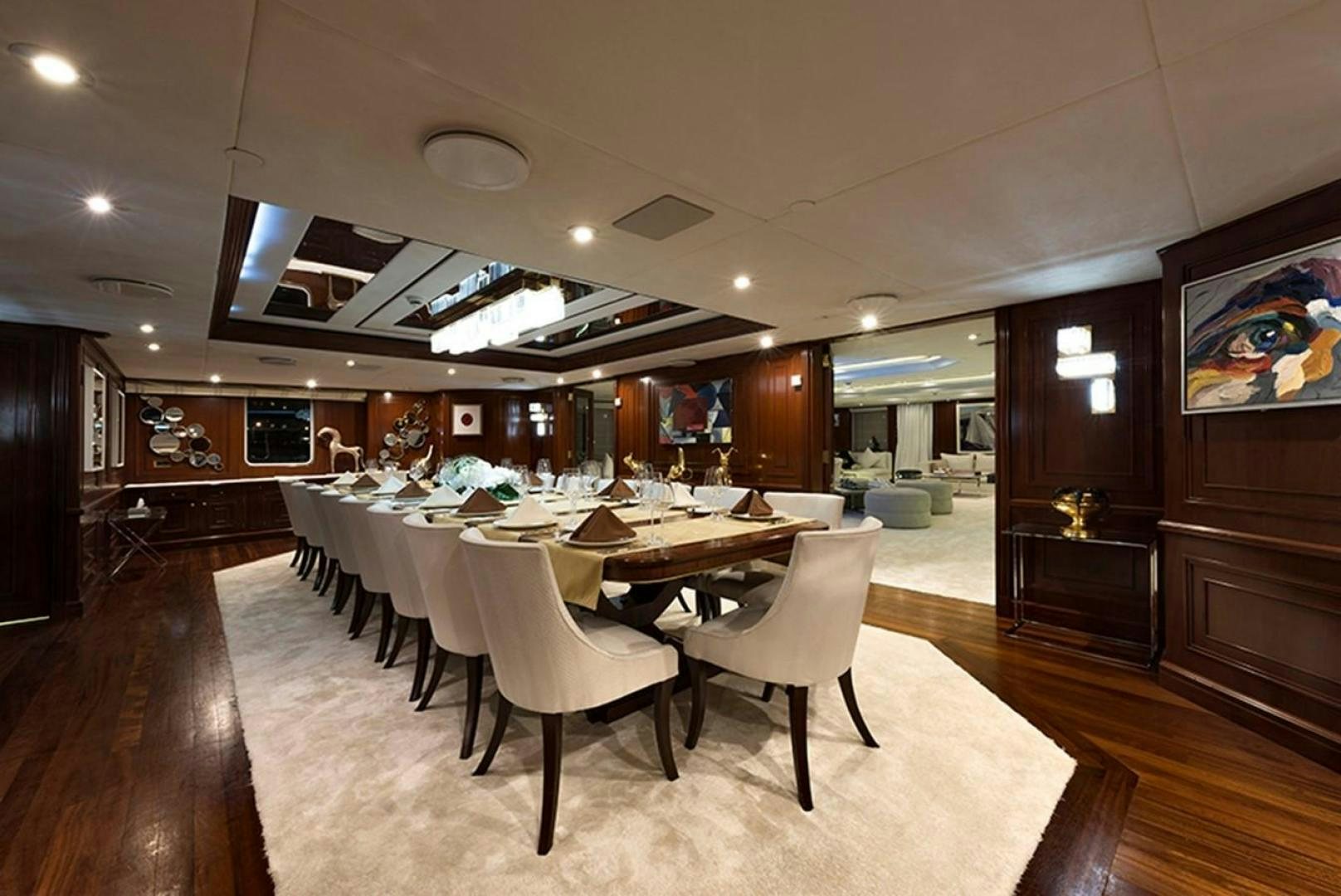 a large dining room with a table and chairs aboard CHAKRA Yacht for Sale