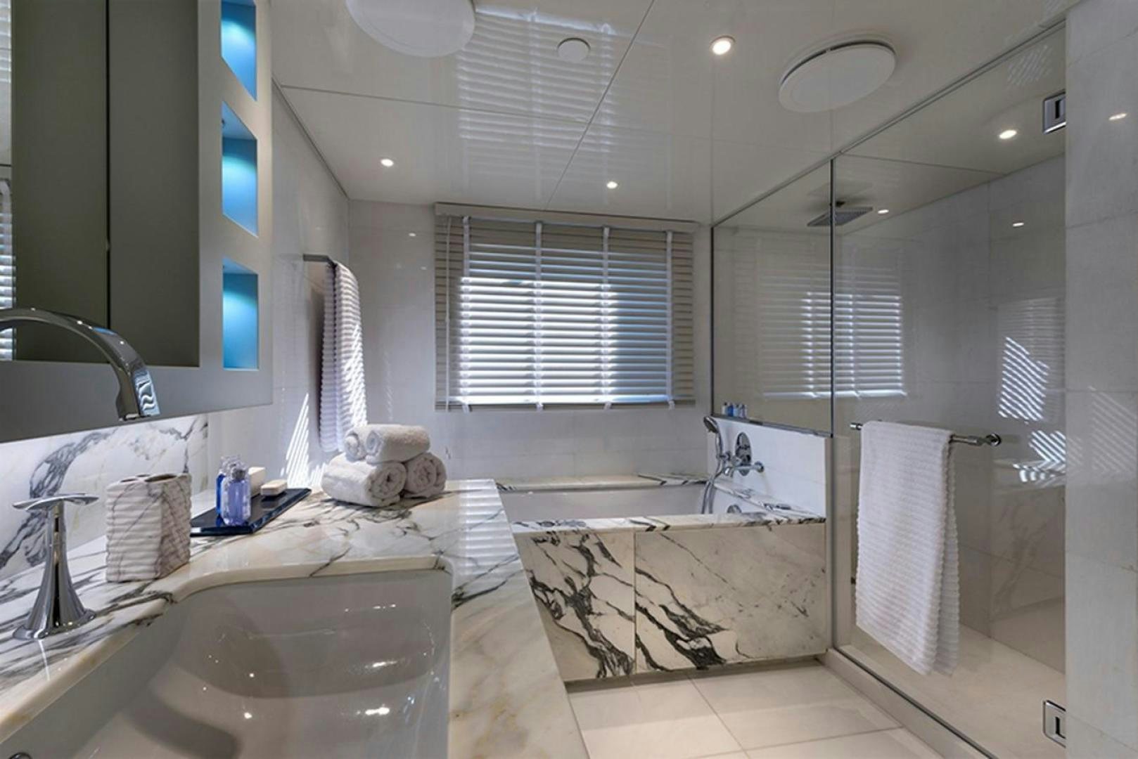 a bathroom with a large bathtub aboard CHAKRA Yacht for Sale