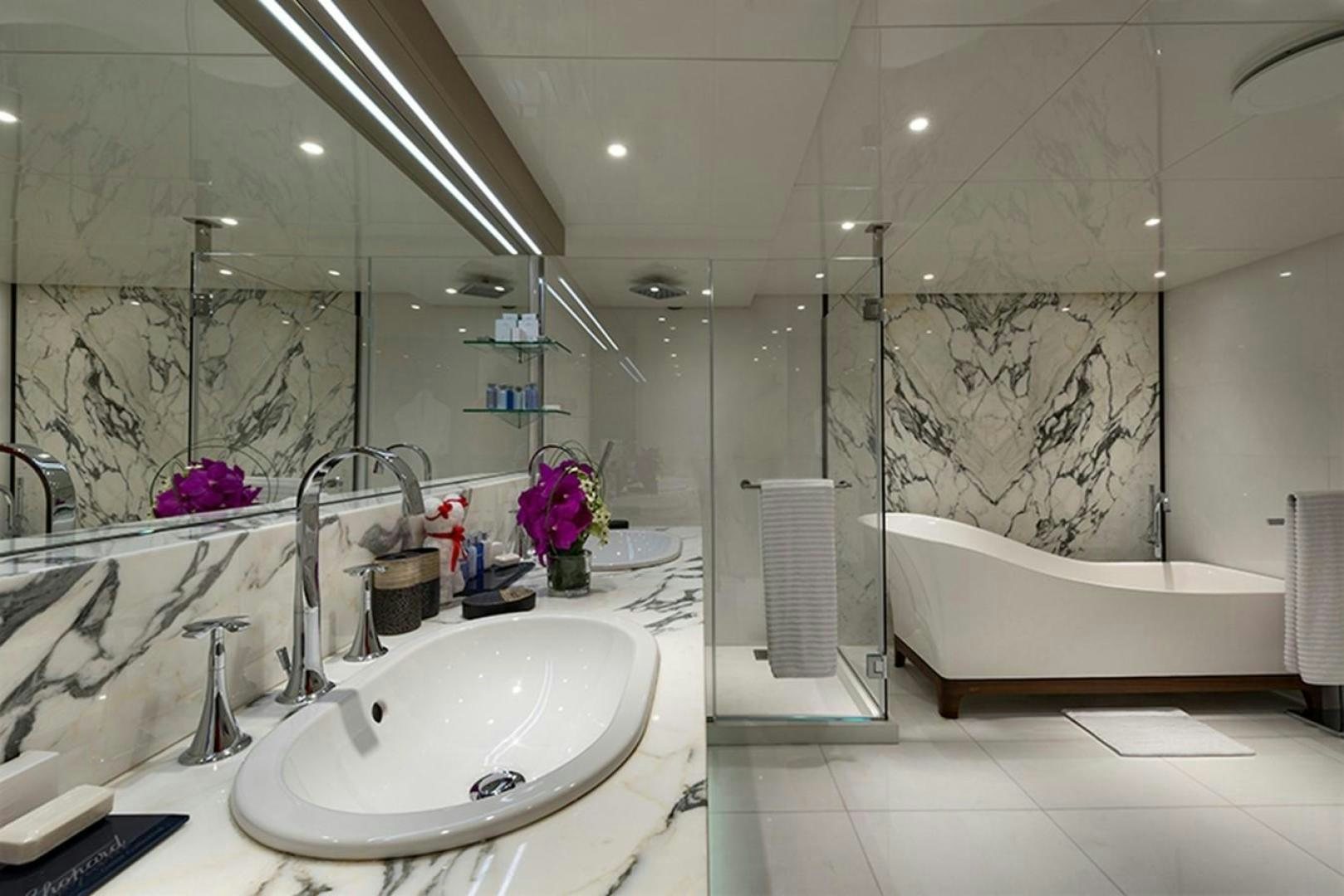 a bathroom with a large mirror aboard CHAKRA Yacht for Sale