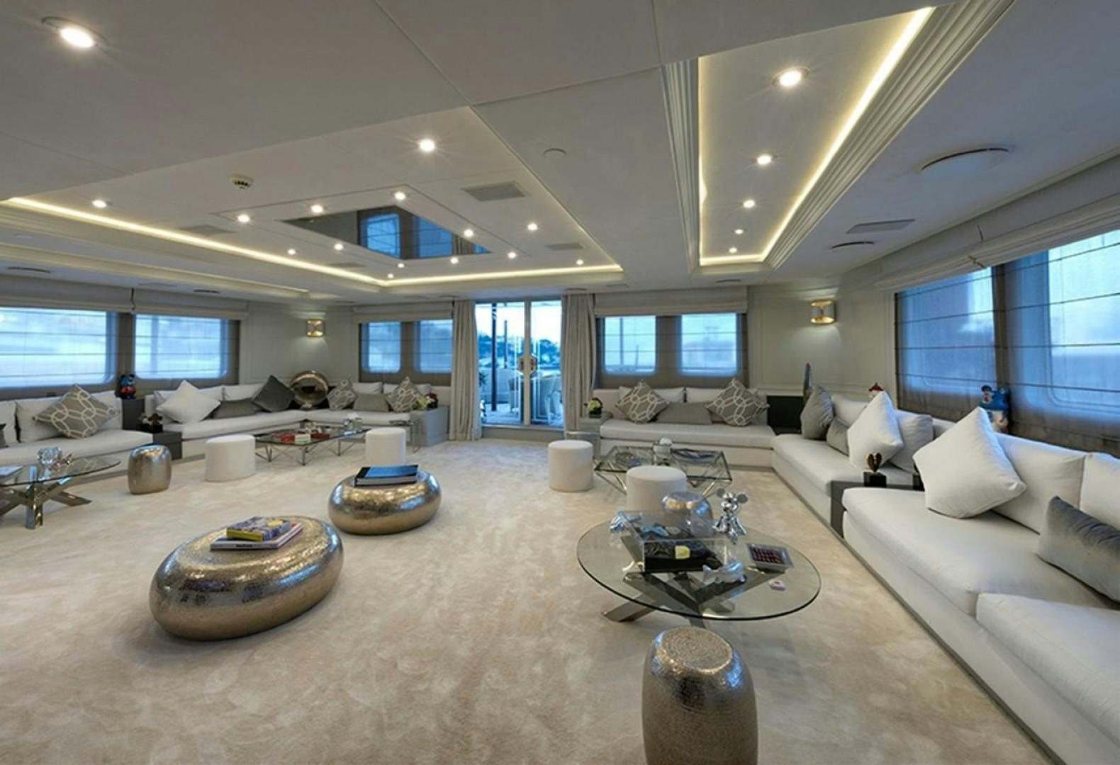 a large living room with a large window aboard CHAKRA Yacht for Sale