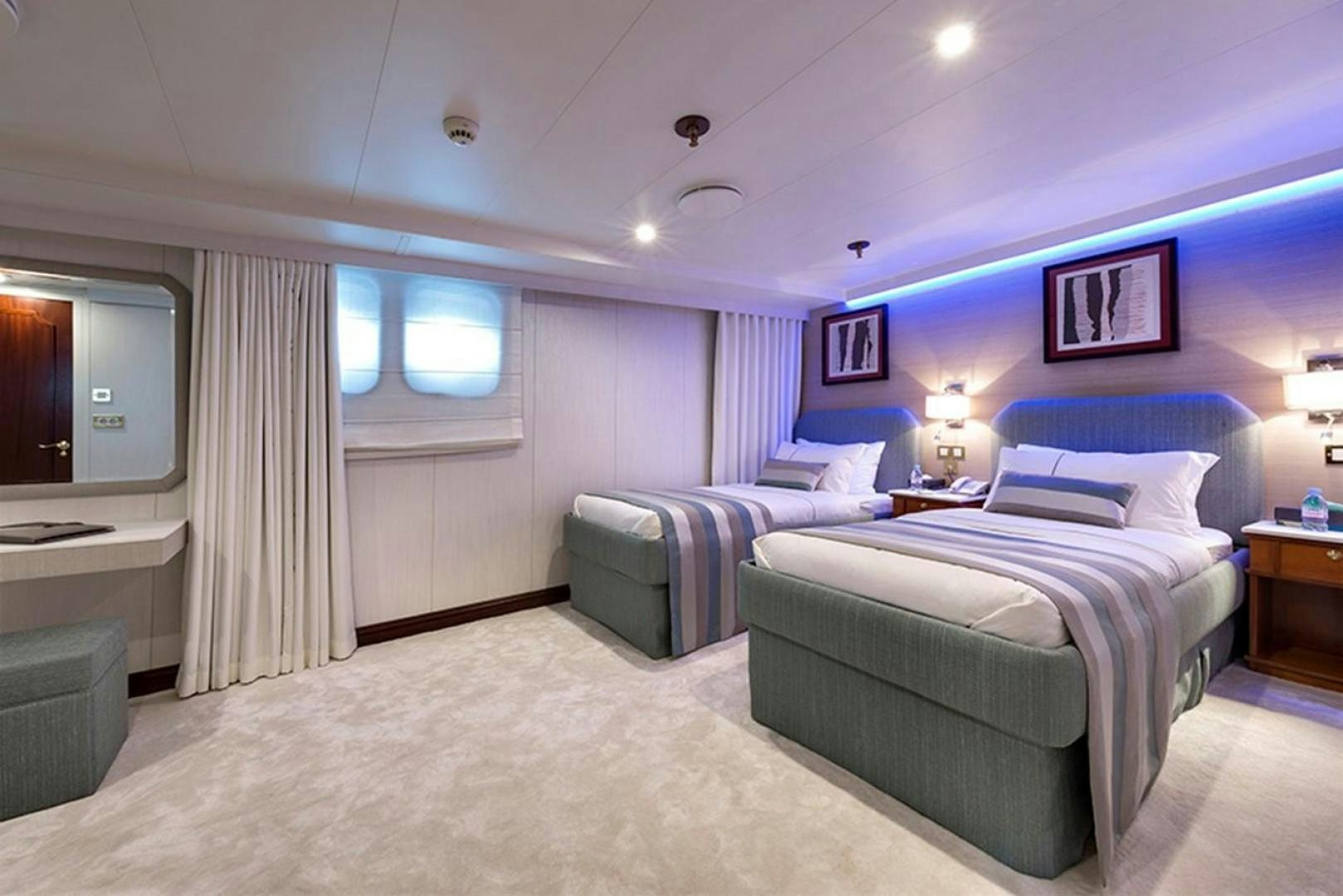 a room with two beds aboard CHAKRA Yacht for Sale