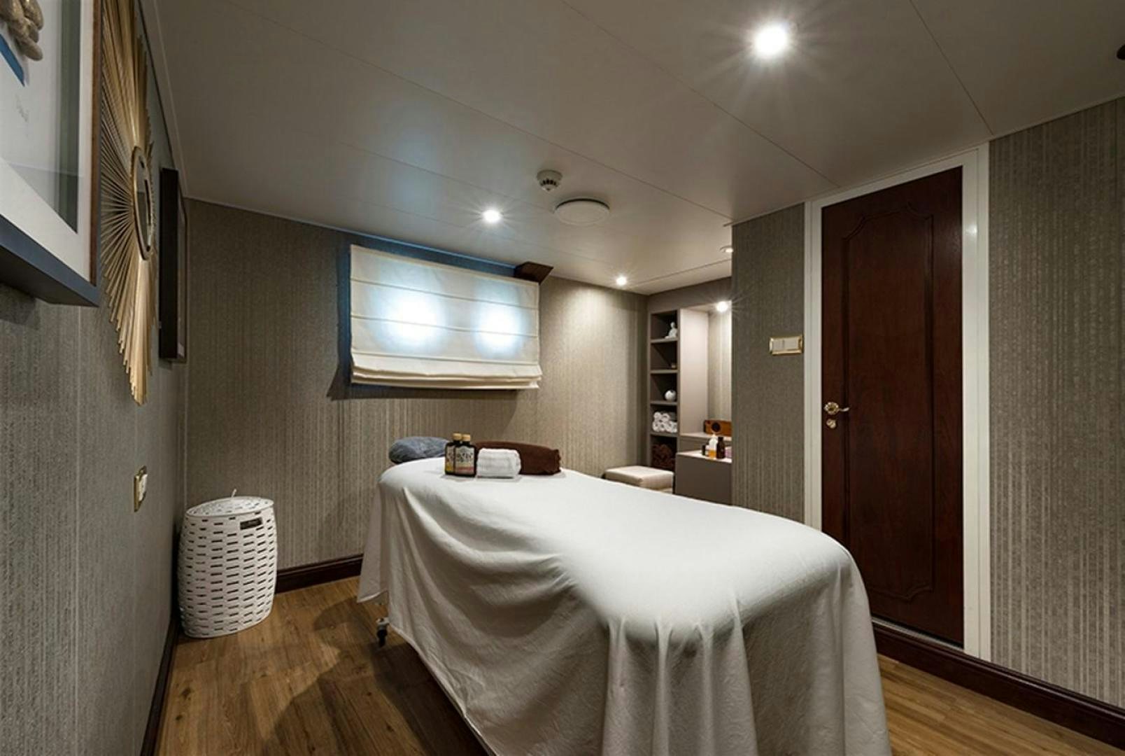 a bedroom with a bed aboard CHAKRA Yacht for Sale