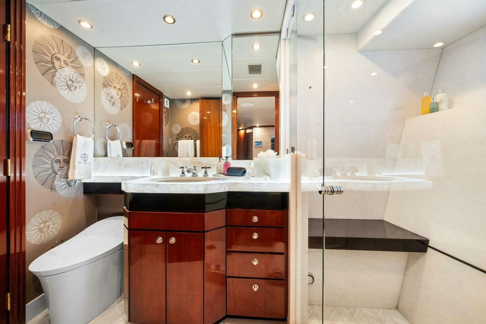 a bathroom with a large mirror aboard SWEET ESCAPE Yacht for Sale
