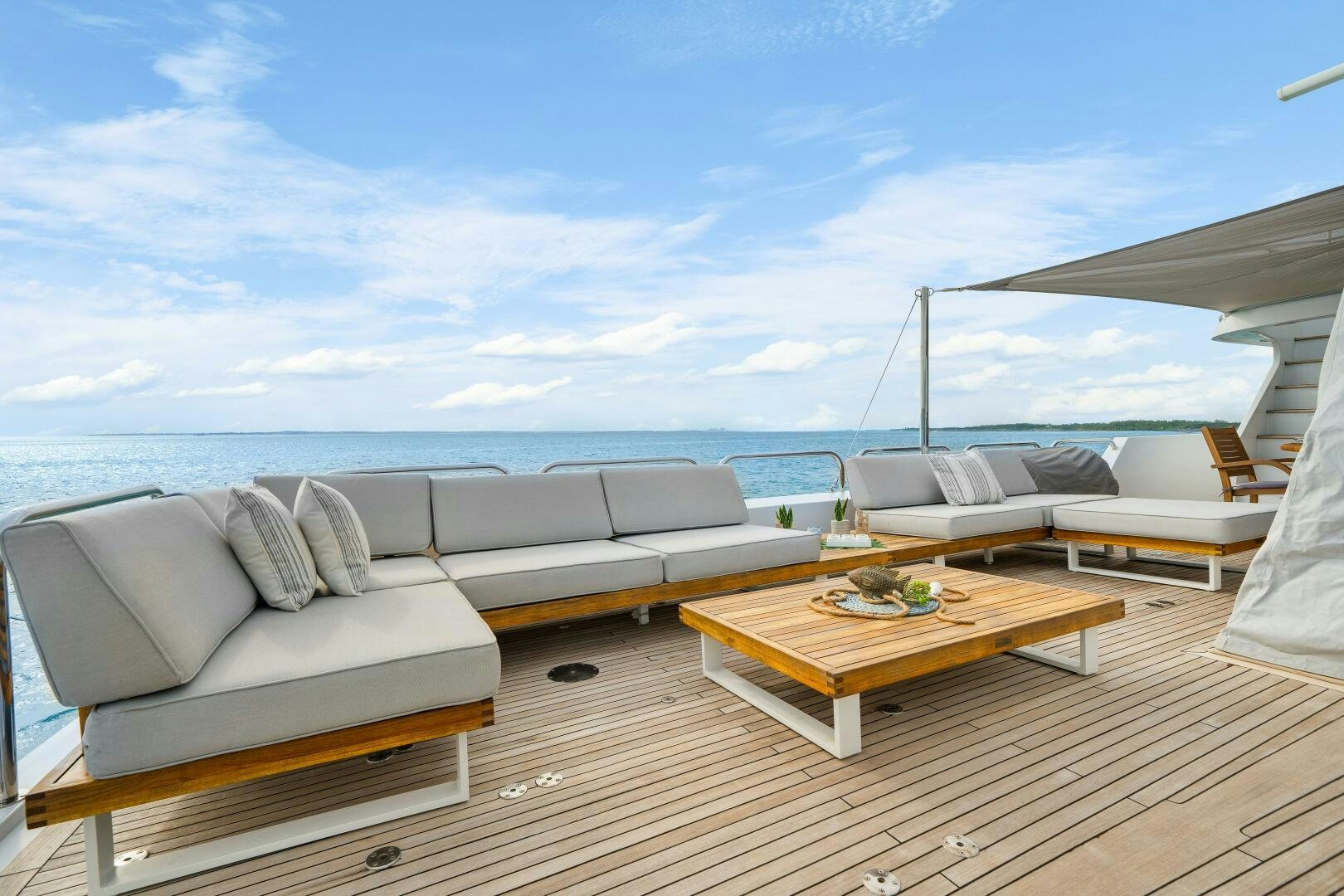 a large living room with a large body of water aboard SWEET ESCAPE Yacht for Sale