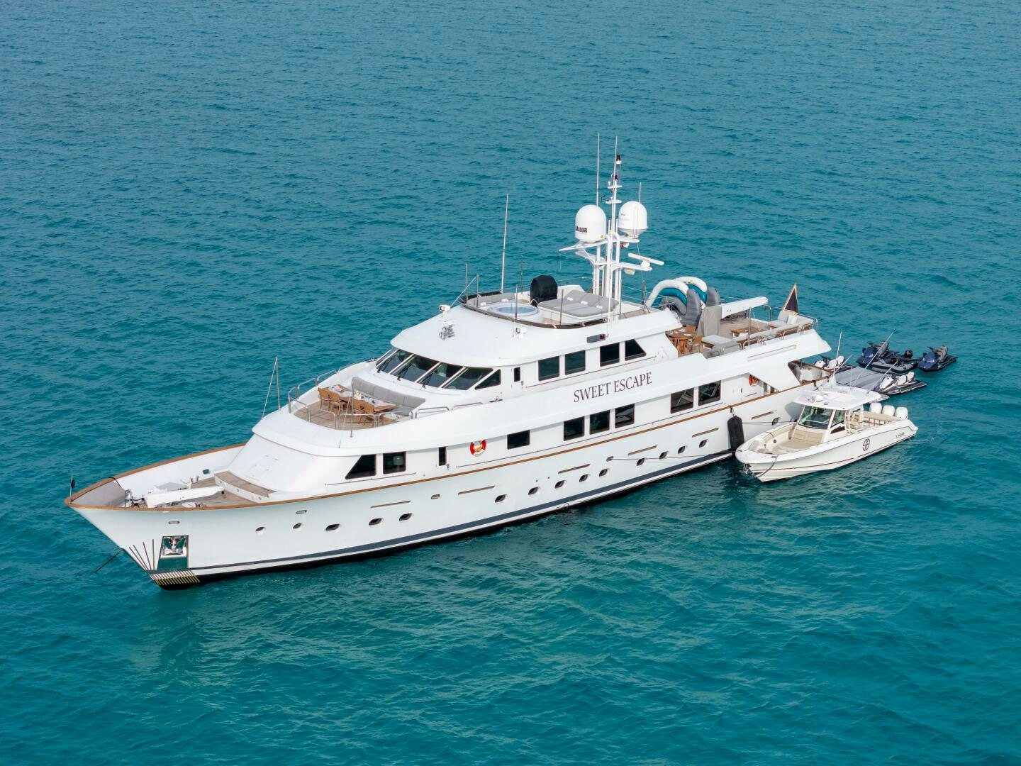 a large white boat in the water aboard SWEET ESCAPE Yacht for Sale