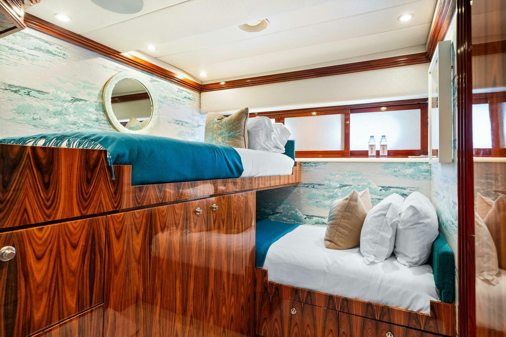 a room with a bed and a mirror aboard SWEET ESCAPE Yacht for Sale