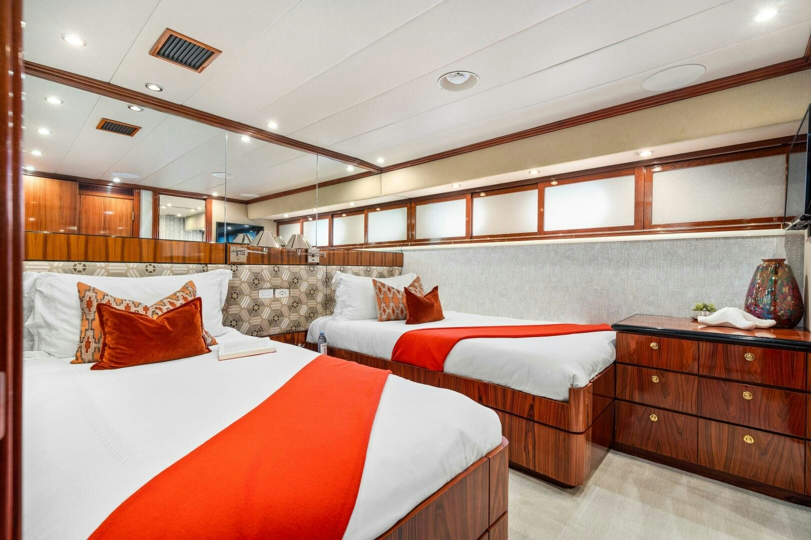 a room with a bed and a couch aboard SWEET ESCAPE Yacht for Sale