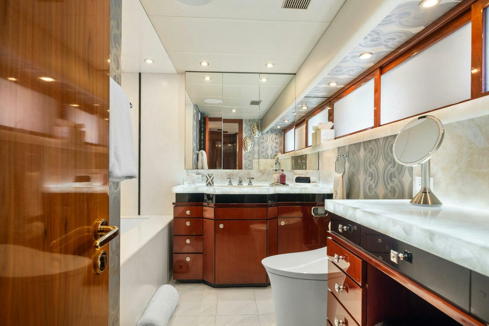 a bathroom with a sink and a toilet aboard SWEET ESCAPE Yacht for Sale