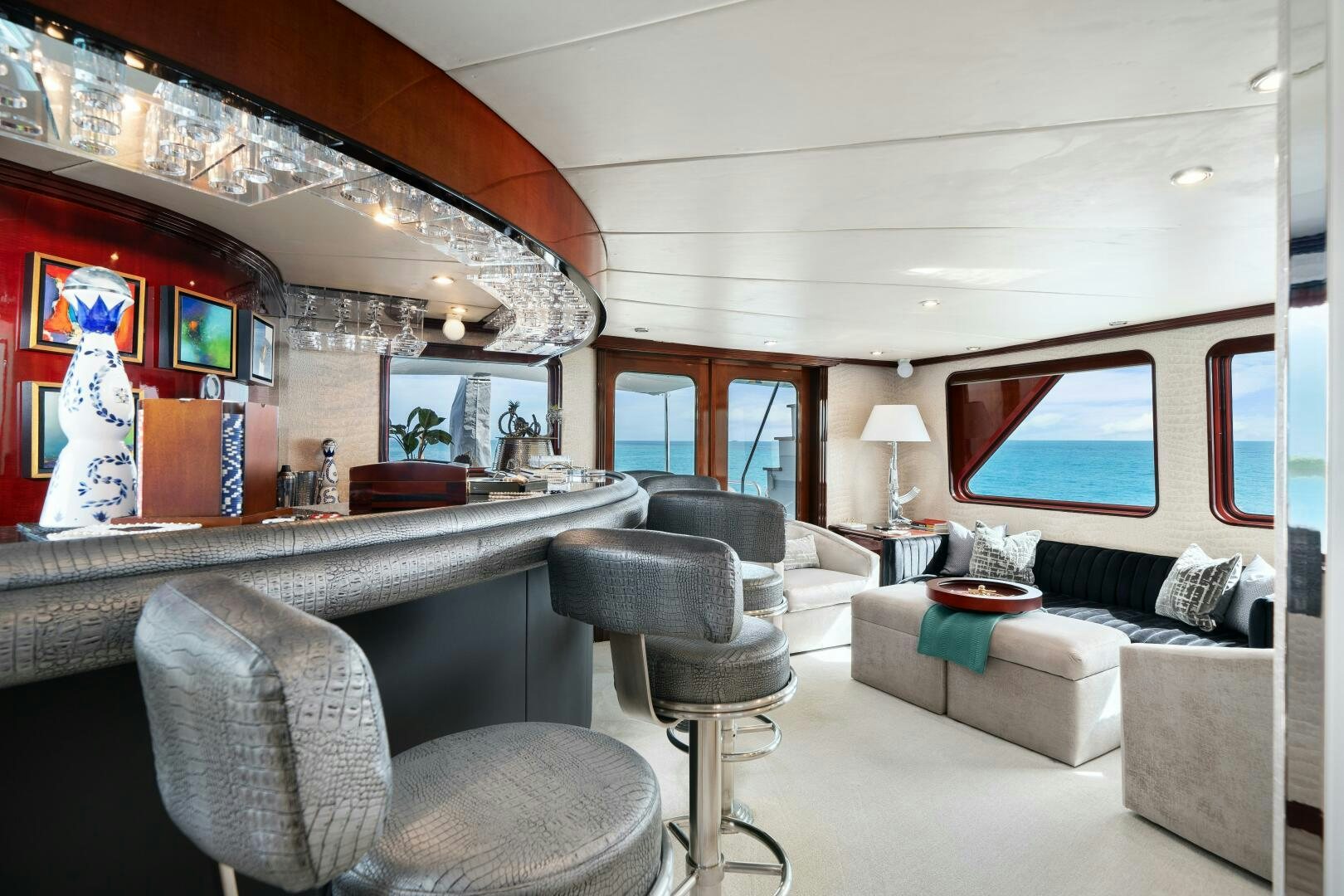 a living room with a large mirror aboard SWEET ESCAPE Yacht for Sale