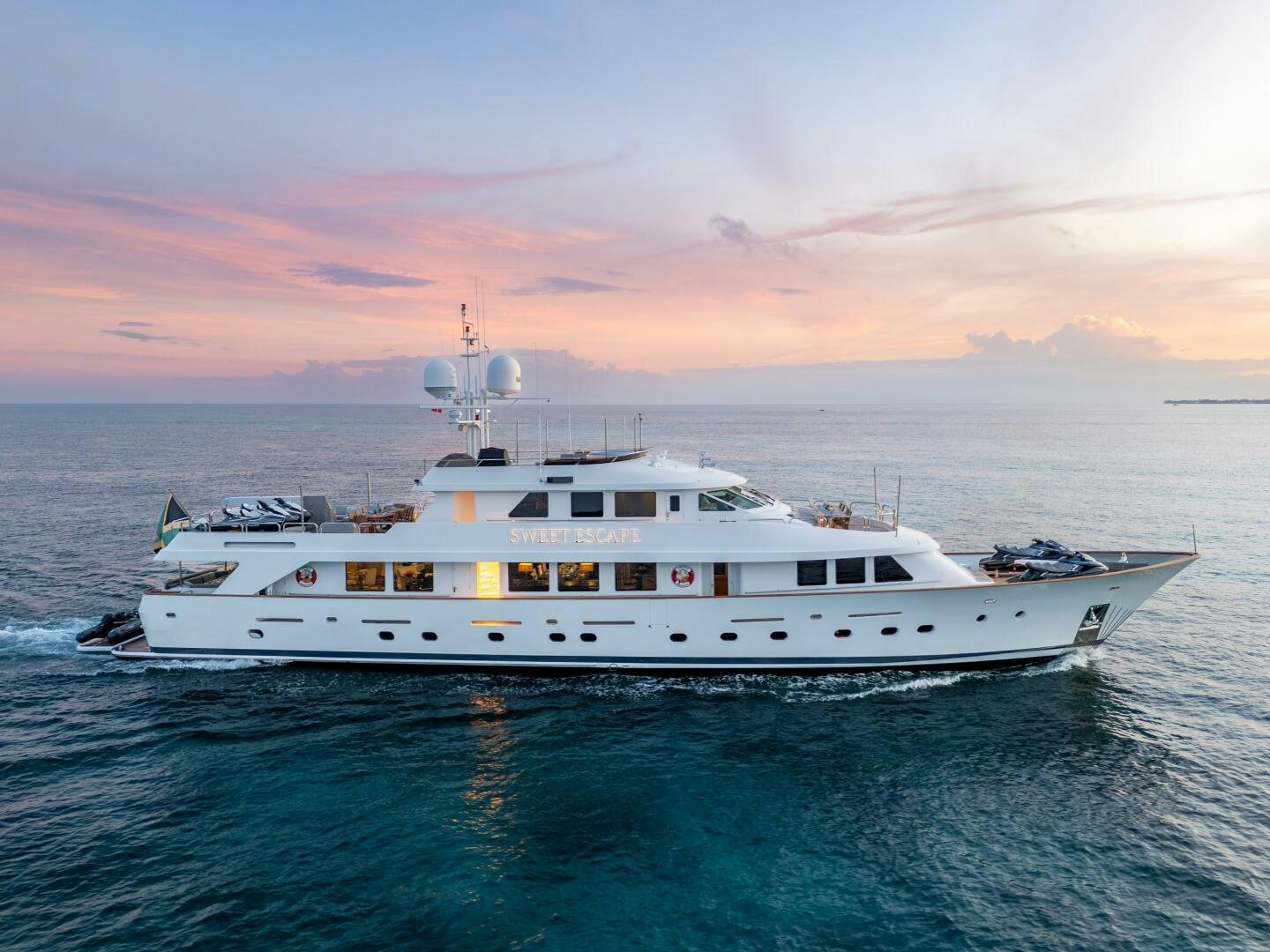 a white yacht in the water aboard SWEET ESCAPE Yacht for Sale