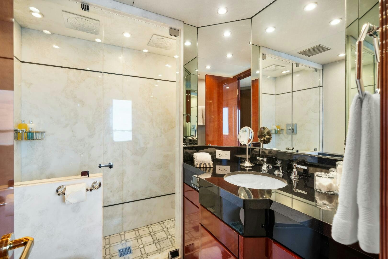 a bathroom with a sink and mirror aboard SWEET ESCAPE Yacht for Sale
