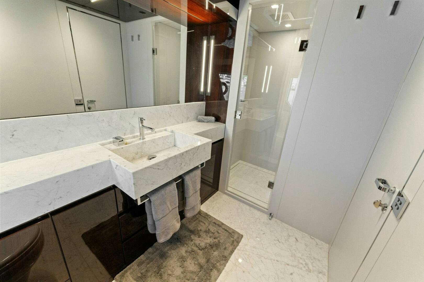 a bathroom with a sink and a mirror aboard RIVA 110/29 Yacht for Sale