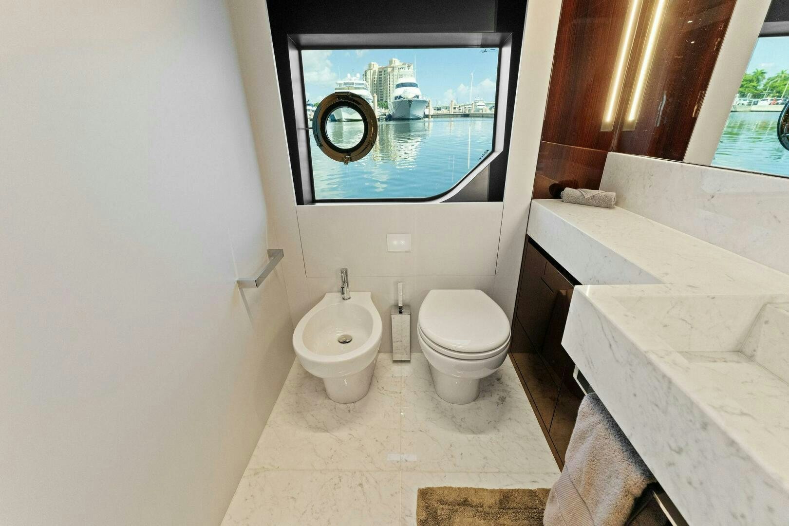 a bathroom with a large mirror aboard RIVA 110/29 Yacht for Sale