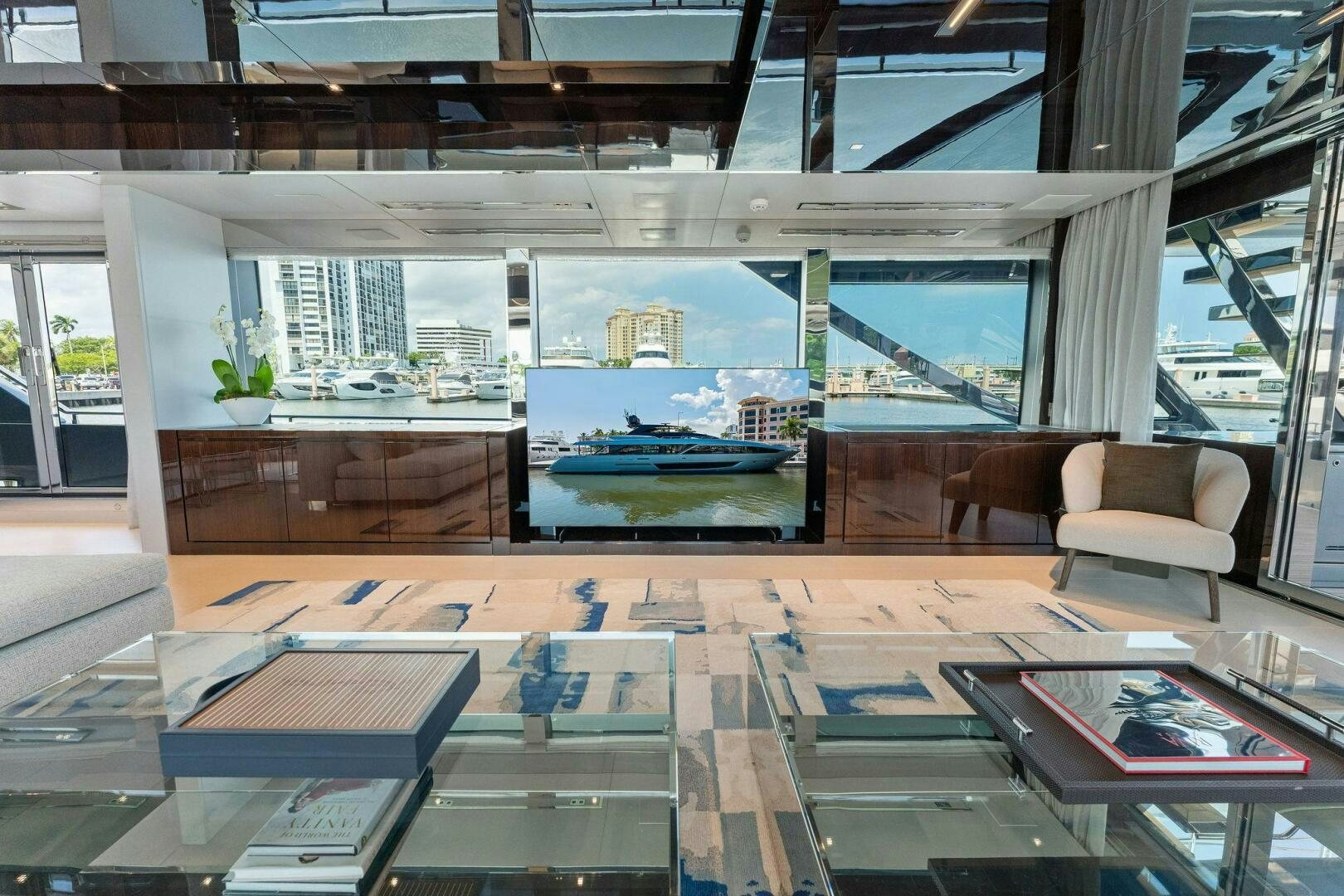 a room with a pool table and chairs aboard RIVA 110/29 Yacht for Sale
