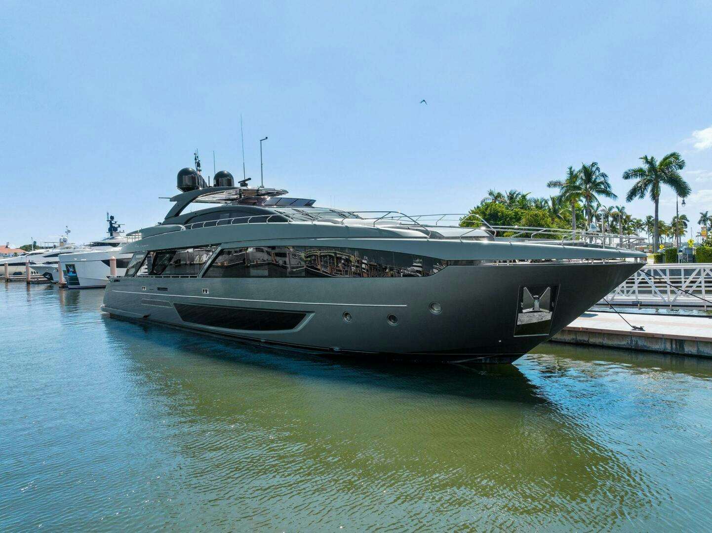 a boat docked at a pier aboard RIVA 110/29 Yacht for Sale