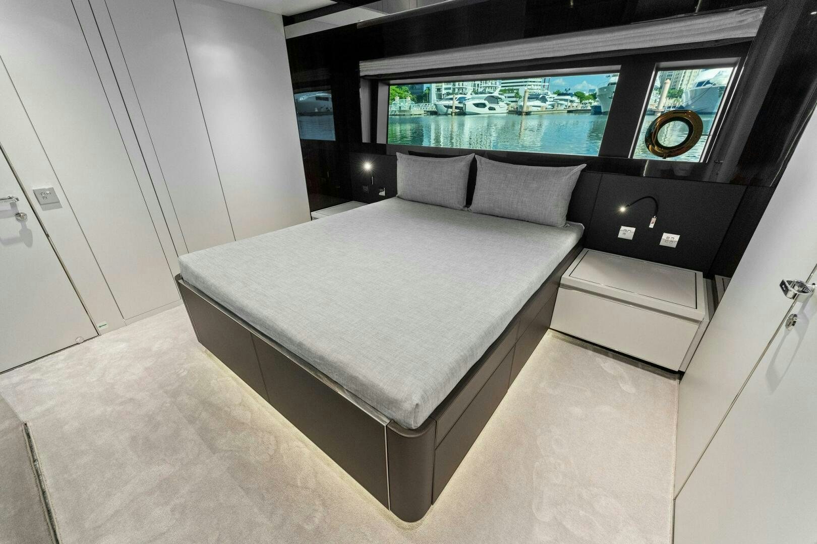 a bed in a room aboard RIVA 110/29 Yacht for Sale