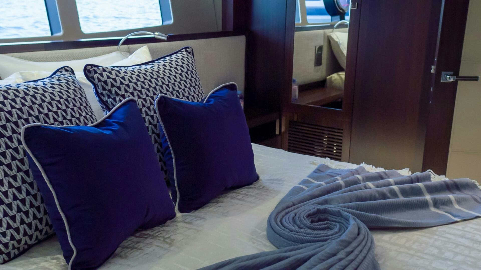 a bed with pillows aboard MR. K IRISTON Yacht for Sale