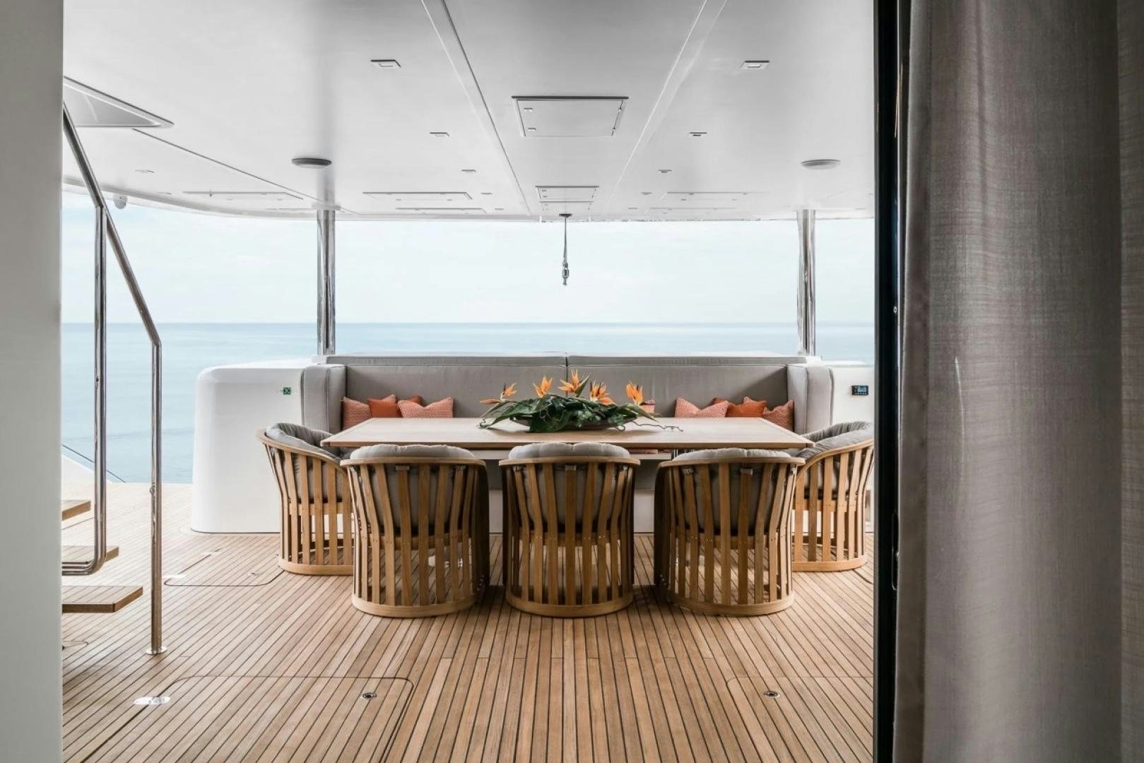 a room with a table and chairs aboard LITTLE GIANT Yacht for Sale