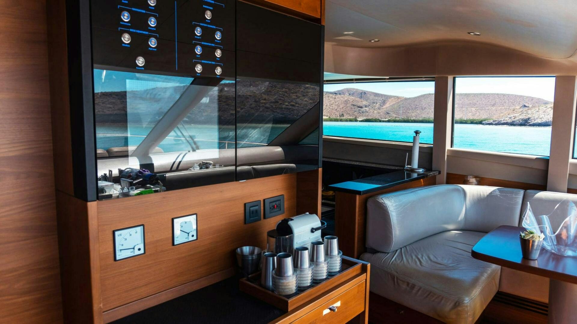 a room with a couch and a coffee table aboard SATORI Yacht for Sale